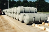 Cylinders are placed on concrete  stillages to protect them from wet ground