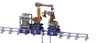 Industrial robots are mounted on a rail on scissor lifts for reach